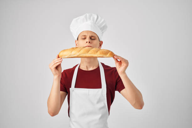 istock chef with loaf in hand baking food preparation professionals 2079360865