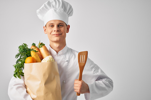 chef with a package of fresh food cooking. High quality photo