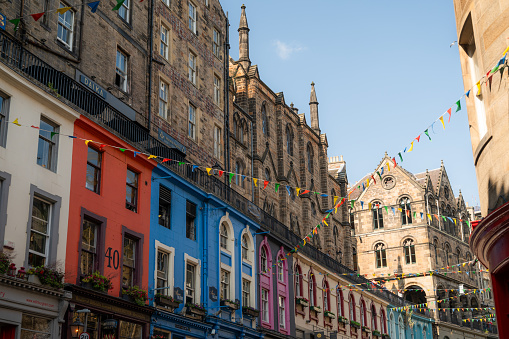 Victoria Street in downtown Edinburgh decorated with flags for the August party, Scotland. High quality photo