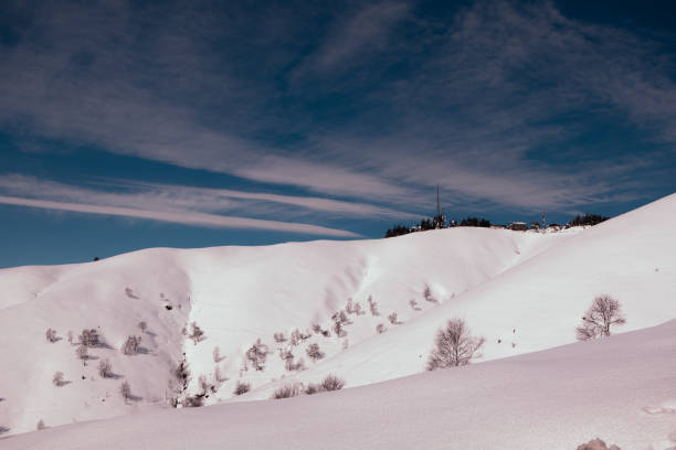 Suggestive view of the slopes of the mountain, after a snowfall. Mottarone mountain (Stresa) - Piedmont, Italy.