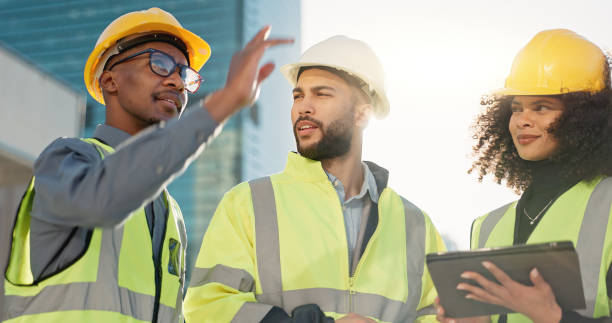 istock People, architect and tablet in city for construction planning, team discussion or strategy on site. Group of employees, contractor or engineer on technology in teamwork, project plan or architecture 2079407686