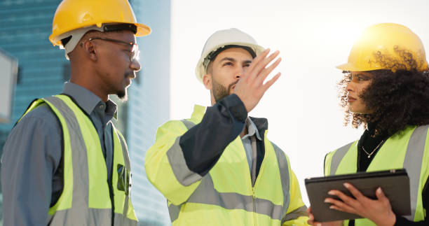 istock People, architect and tablet in city for construction planning, team discussion or strategy on site. Group of employees, contractor or engineer on technology in teamwork, project plan or architecture 2079407688
