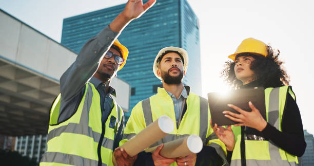 istock People, architect and team with tablet in city planning for construction, building or project. Group of employees, contractor or engineer in teamwork with technology for architecture plan on site 2079407694