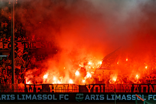 Limassol, Cyprus - August 28, 2022: Fans of AEL with flares at Tsirio stadium during AEL - Aris match