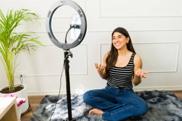 istock Young woman creating video content at home 2079469126