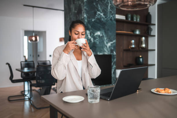 istock Young Mexican Female Entrepreneur Drinking Coffee 2079475915