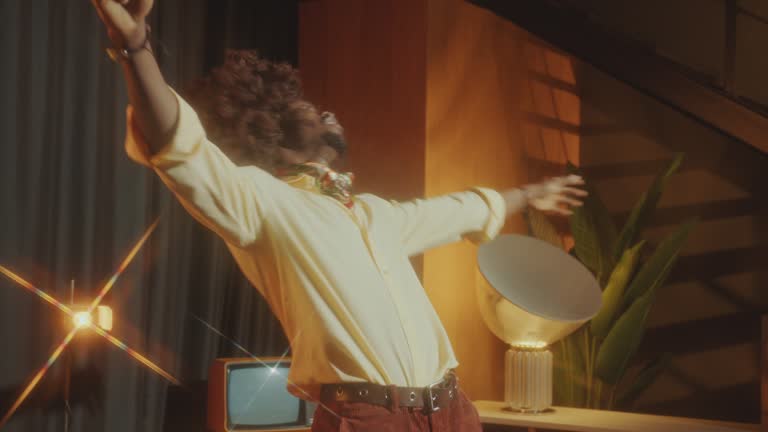 Relaxed Man Enjoying Music and Dancing in Retro Studio