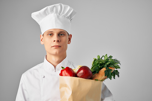 man with food package healthy food kitchen restaurant work. High quality photo
