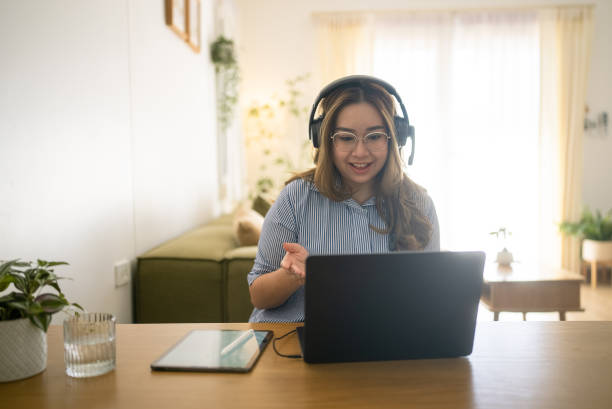 istock Cheerful freelancer sitting and talking about project with coworker while working from home on holiday. 2079525215