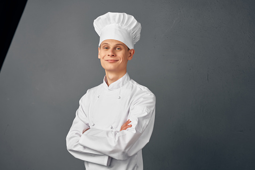 male chef professional in uniform working in a restaurant. High quality photo