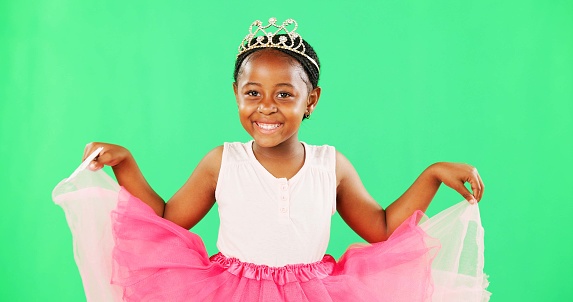 Portrait, black girl and cute in studio with greenscreen, isolated and princess costume for halloween or birthday party. Child, chromakey display and mockup background for marketing and advertising.