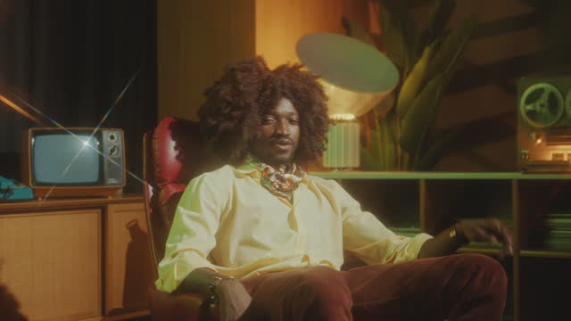 Handsome African American Man in Retro Outfit Posing in Vintage Studio