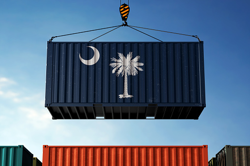 South Carolina trade cargo container hanging against clouds background