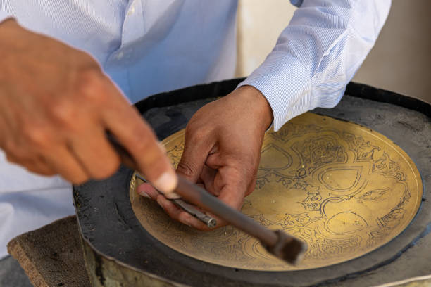 istock The master doing the metal work to sell it as a souvenir 2079604152