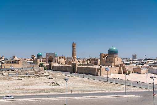 JUNE 27, 2023: Panorama of Bukhara, Uzbekistan. Aerial view of Kalan Minaret Emir and Alim Khan madrasah of Po-i-Kalan (Poi Kalan) - islamic religious complex