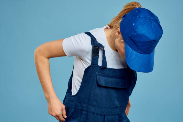 istock Woman in work uniform professional service blue background 2079628046