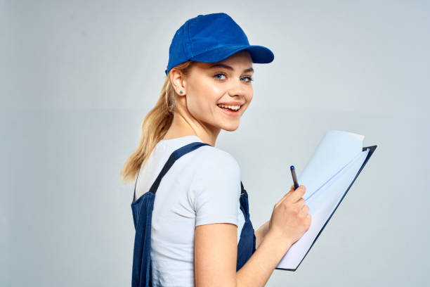 istock Woman courier in uniform documents service delivery 2079640400