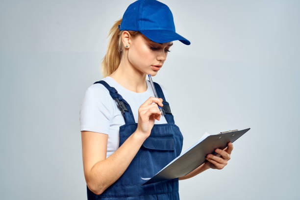 istock Woman courier in uniform documents service delivery 2079640957
