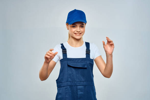 istock Woman in working uniform blue cap service lifestyle service 2079642109