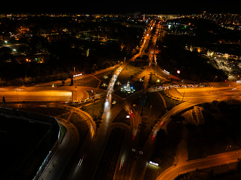 Aerial view  of vehicle traffic at a road Intersection at night. Antalya, Turkey.
