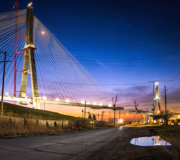 The Gordie Howe International Bridge, is expected to be fully constructed and open for business by 2024/2025.   The bridge will link Detroit, Michigan with Windsor, Ontario.