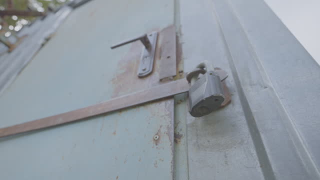 Lock on old door to enter building on site of country house