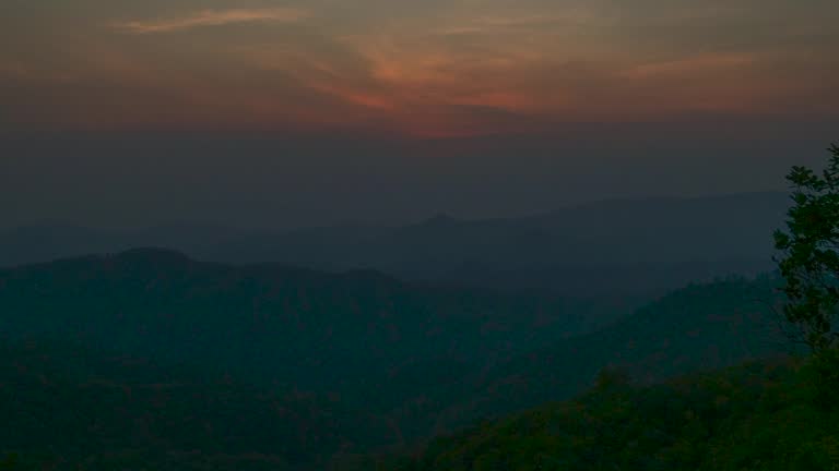 Timelapse Sunset mountain range beautiful landscape mist, dusk golden time dramatic sky. Time lapse Beautiful landscape motion high mountain ridge mist panning panorama scenery dawn dramatic sky.