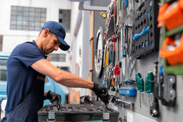 istock Mechanic working at a bicycle repair shop using tools 2079720312