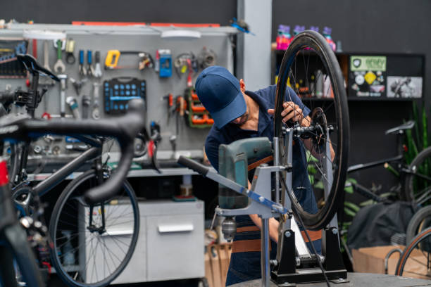 istock Mechanic fixing a bicycle at a repair shop 2079720345