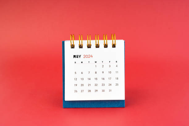 istock May 2024 white desk calendar on red. 2079742078