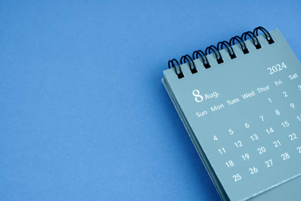 istock August 2024 desk calendar on blue color background. 2079743823