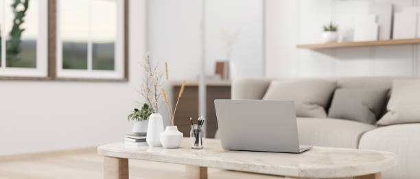istock A laptop computer on a luxurious white marble coffee table in a contemporary living room. 2079758857