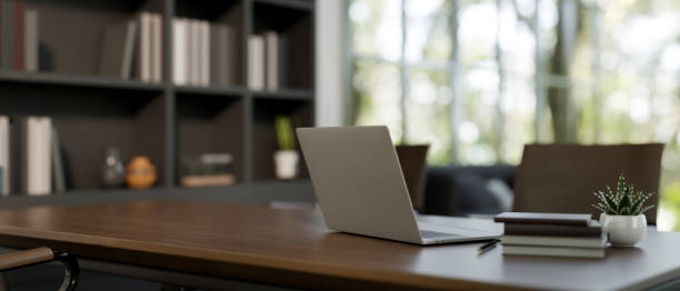 istock A laptop computer on a meeting table in a contemporary meeting room. 2079761455