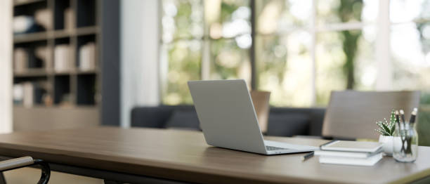 istock A laptop computer on a meeting table in a contemporary meeting room. 2079761462