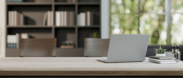 istock A meeting table features a laptop computer and stuff in a contemporary meeting room. 2079761468