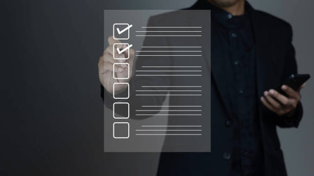 istock Businessman using phone and checking list of virtual document files on dark background. 2079775189
