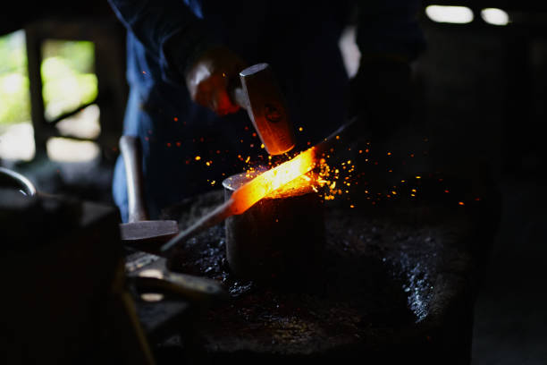 istock The Blacksmith working in fiery workshop with metal and heat 2079817253