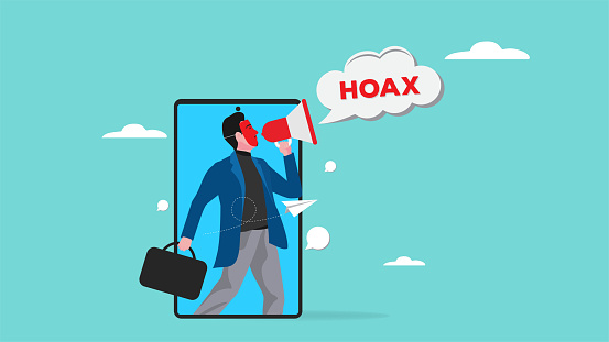 hoax or fake news illustration, misleading information from social media that creates misunderstandings, masked businessman using megaphone conveying fake news or hoax on smartphone illustration