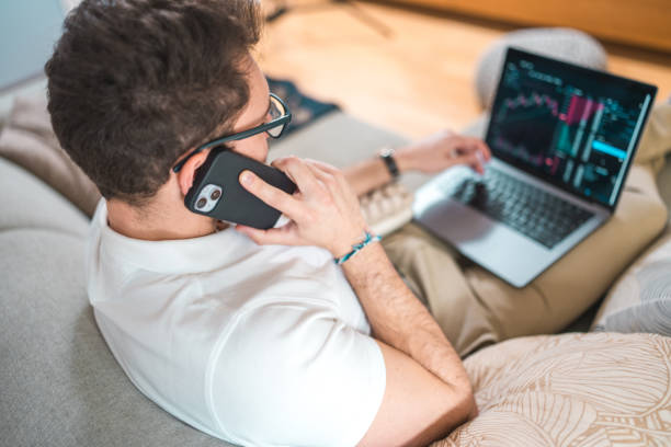 istock Hispanic Young Adult Investor Analyzing Data on Laptop 2079893868