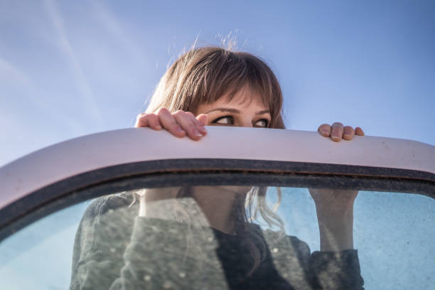 Peeking Over Car Window Stylized Abandon Construction Site Junkyard Photoshoot