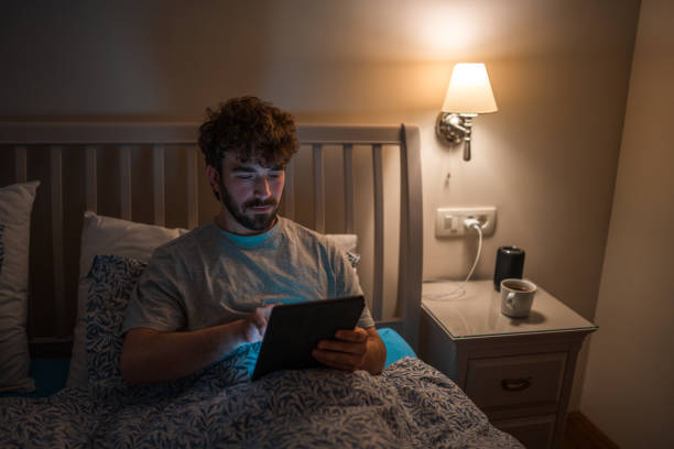 istock Caucasian Male Struggling with Sleep While Using Tablet in Bed 2079908480