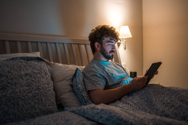 istock Caucasian Male with Insomnia Using Tablet in Bed at Night 2079908484