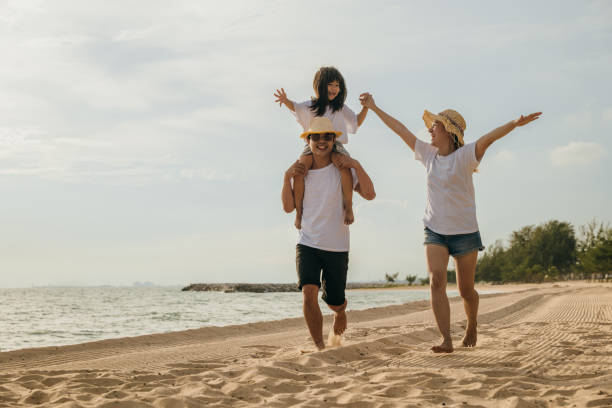 istock Happy family people having fun in summer vacation on beach 2080038608