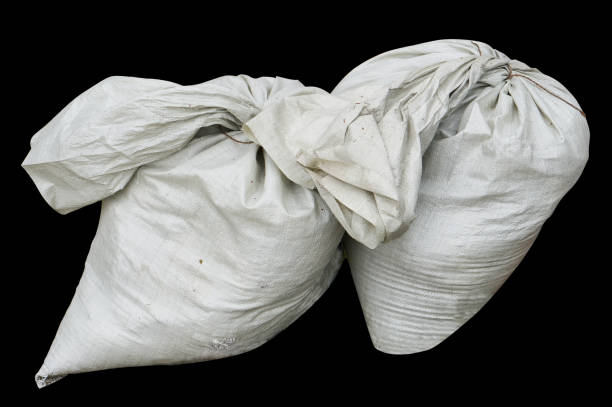 The  canvas bags with rubbish  isolated  on black