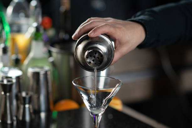 istock Barman Expertly Pours Ginger Apple Vermouth Cocktail 2080095344