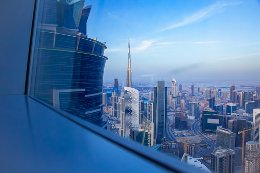 Dubai Downtown cityscape skyscapers and towers skyline with Burj Khalifa view from big glass window