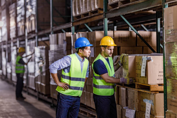 istock Male inspector supervising his worker in distribution warehouse. 2080187434
