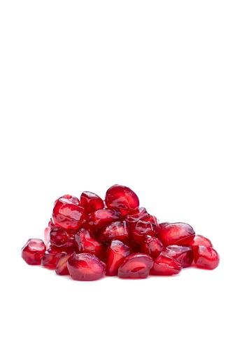 Pomegranate Seeds Isolate on White Background with Copy Space in Vertical Orientation