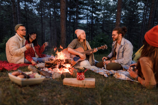 istock Happy friends having fun during camping in the forest. 2080201137