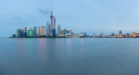 Panoramic skyline of Shanghai and Huangpu river at night